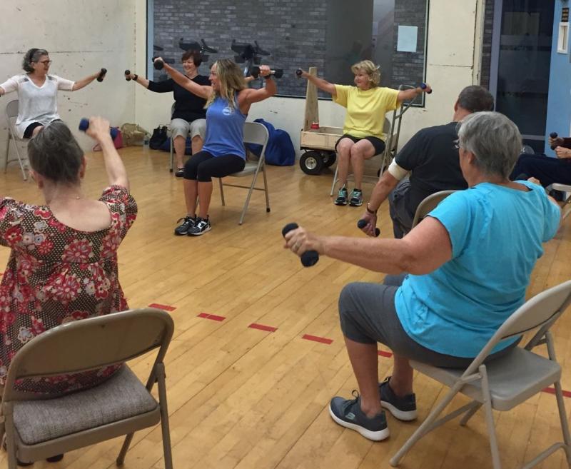 Kelley Harp's class at Midway Fitness helps alleviate the symptoms of Parkinson's disease. Shown are (l-r) Elaine Russo, Gayle August, Kelley Harp, Marge Smith, Glen Elliot and Christine Hamilton. CHRIS ANTONIO PHOTO